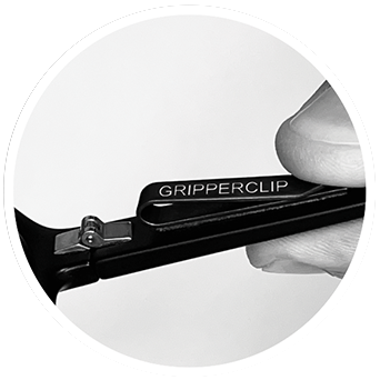 GripperClip placed inside temple arm near hinge on pair of black eyeglasses, sunglasses or readers