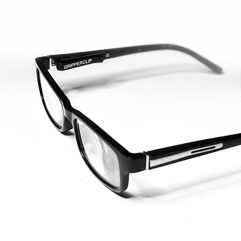 GripperClip shown installed on a pair of black prescription eyeglasses.